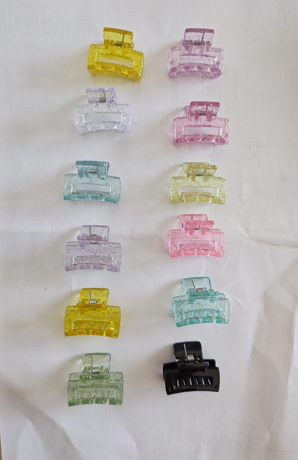 set of 12 small, colorful, glitter-infused plastic hair claw