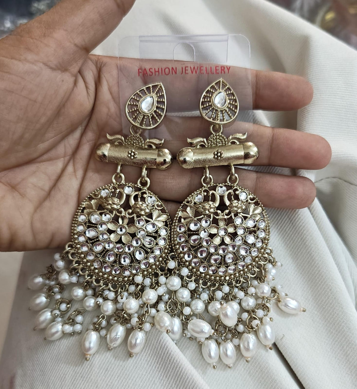 chandbali dangle earring with kundan-style stones, peacock motifs, and white pearl cluster drops