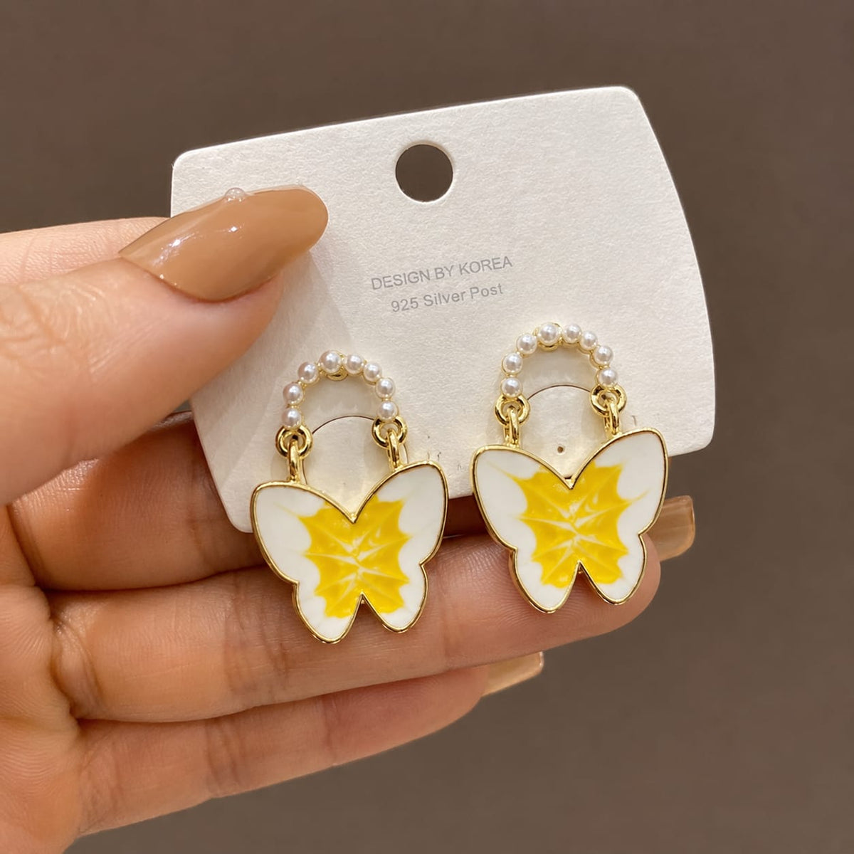 enamel butterfly design accented with small faux pearls