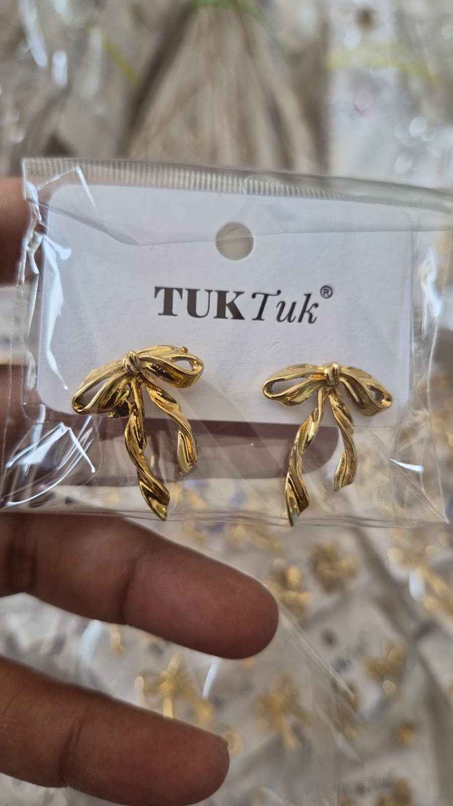 Anti tarnished gold-plated twisted ribbon bow earrings