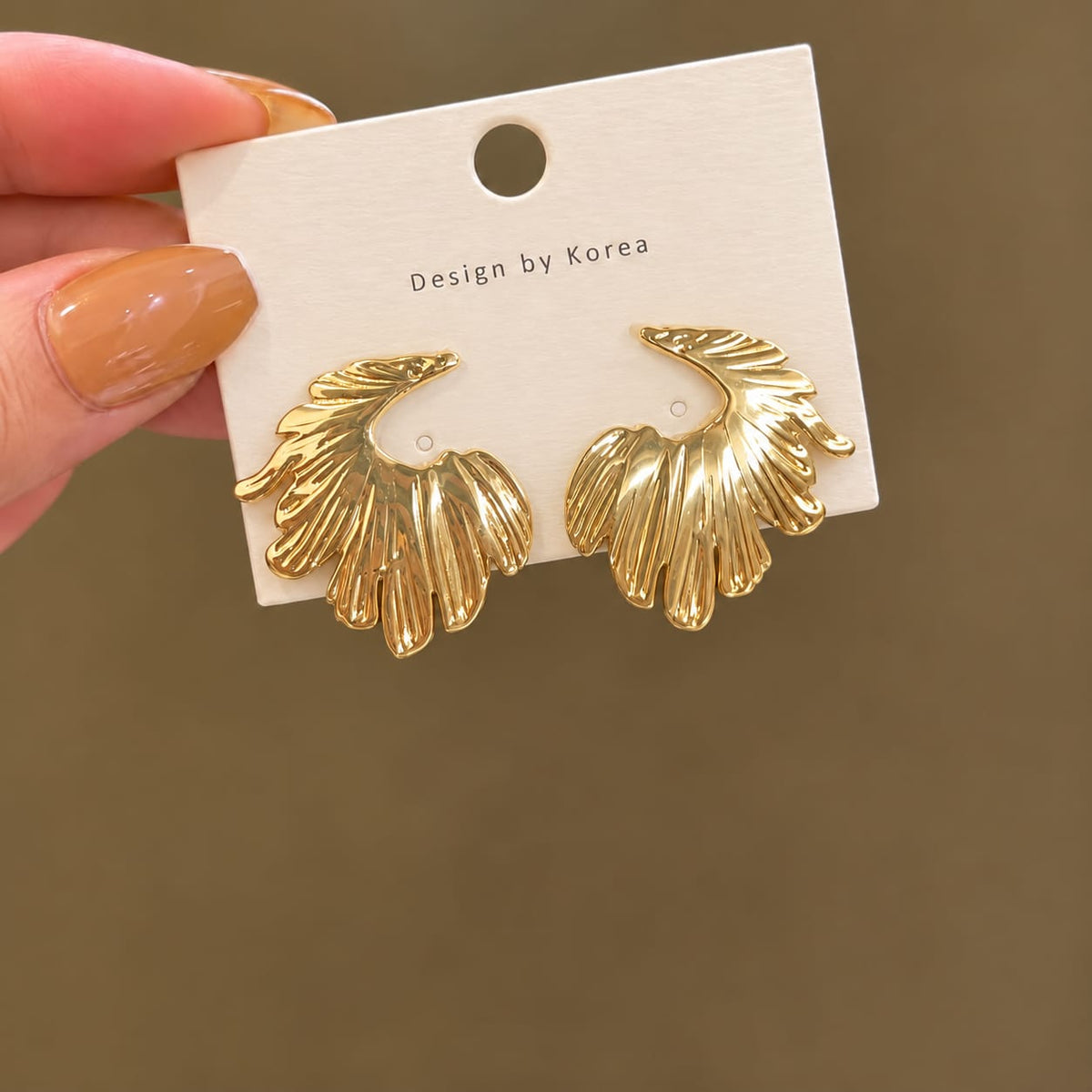 winged shaped earring molten metal design with a stainless steel