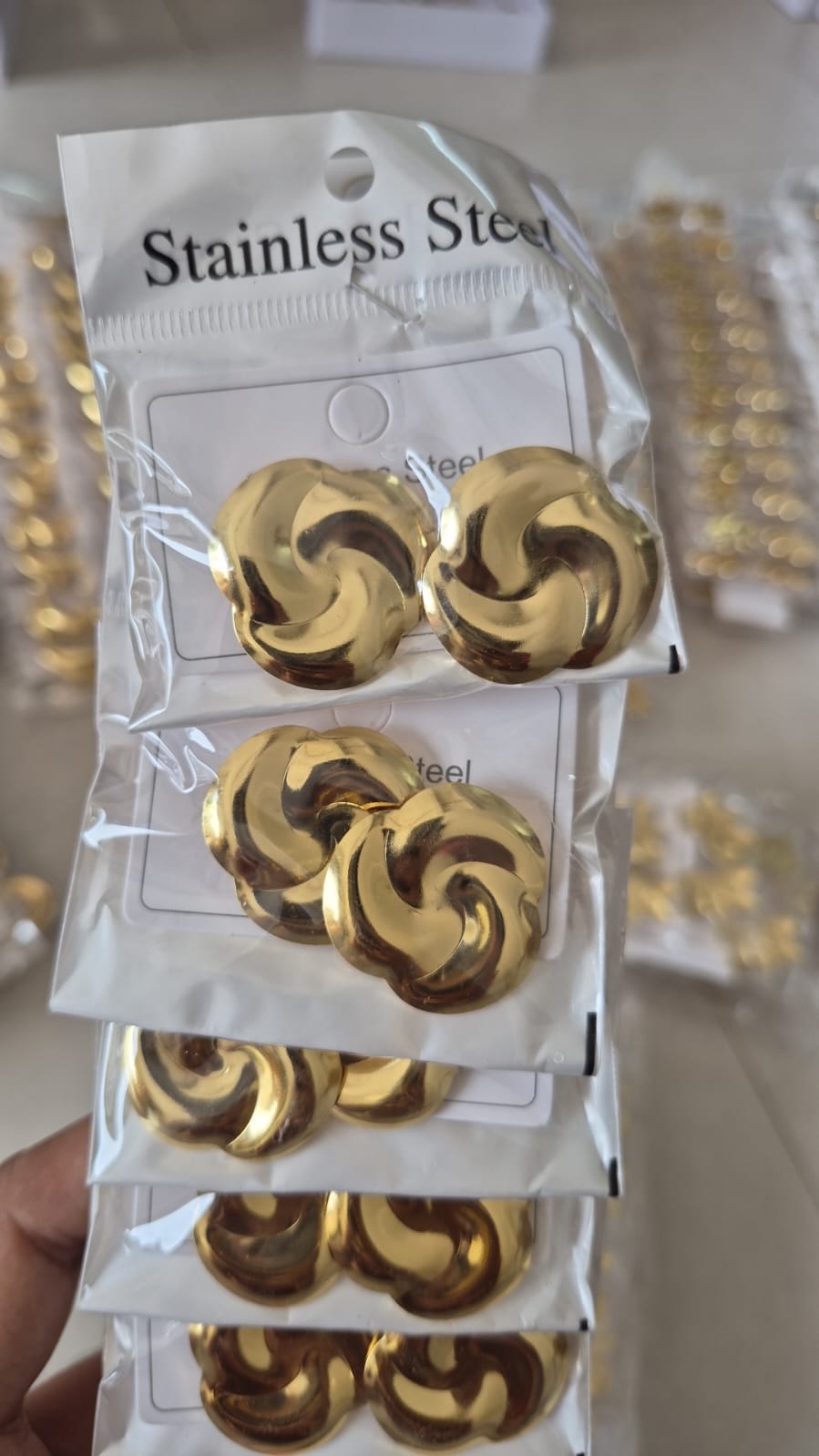 Anti tarnished gold-toned abstract swirl stud earring