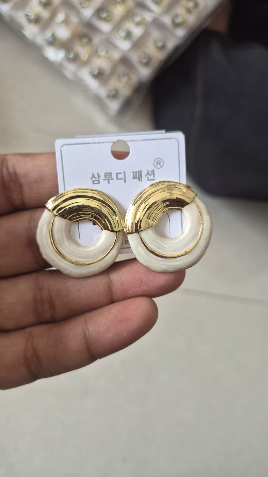 half-halo statement earrings with a textured circular design.