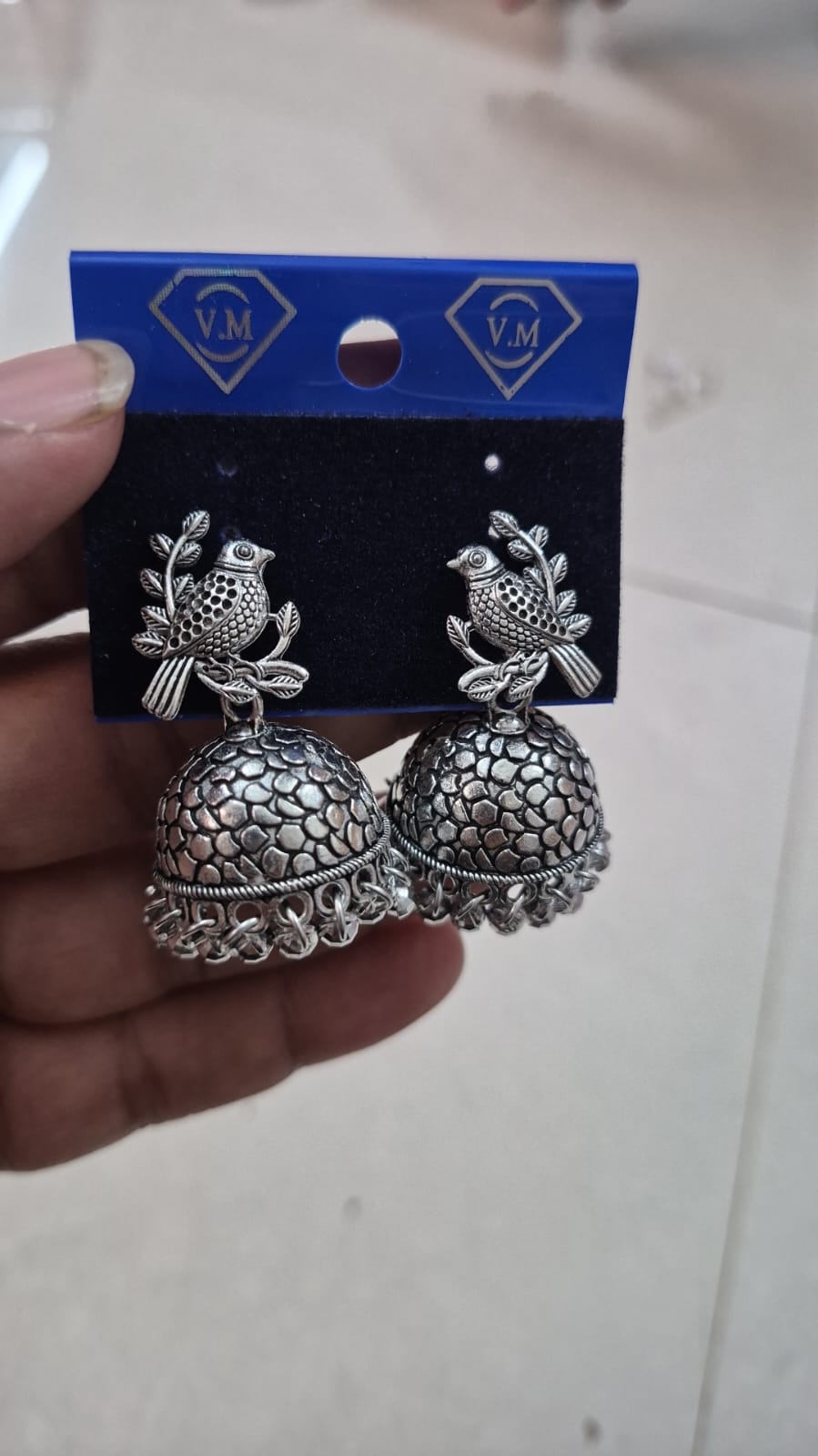oxidized silver-plated bird and branch jhumka earring