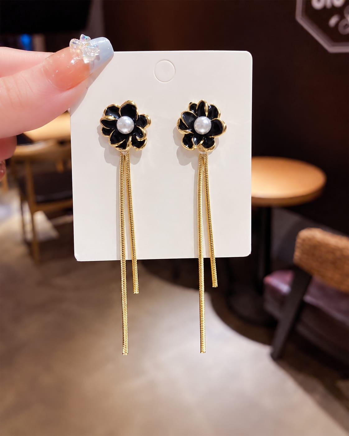 black enamelled flower earrings long dangling chain tassels.