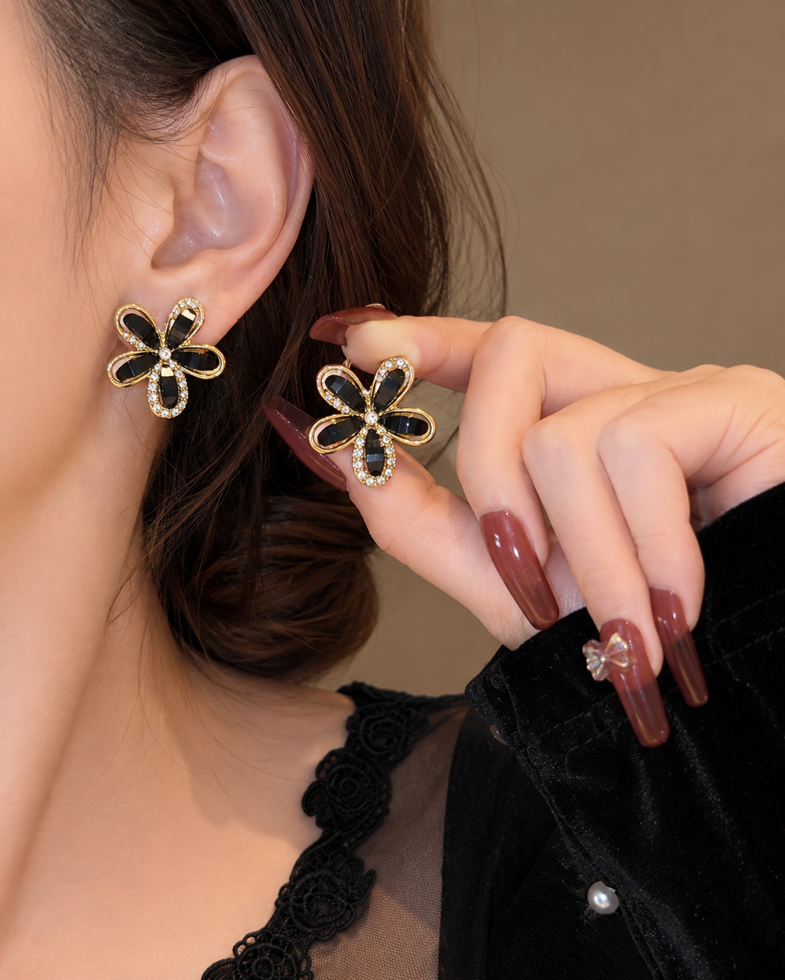 floral stud earrings with black petals and crystal accents