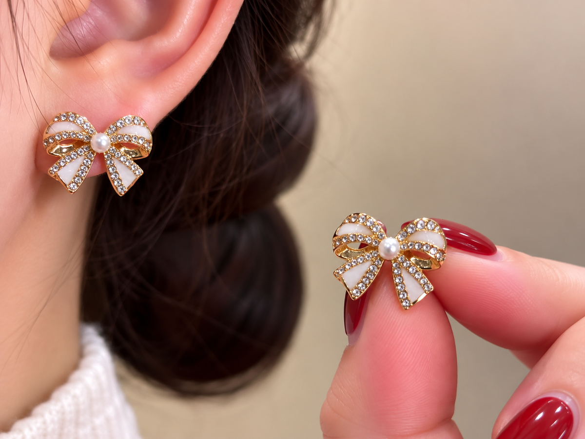 Gold-Tone White Crystal Bow Stud Earrings with Pearl Centers