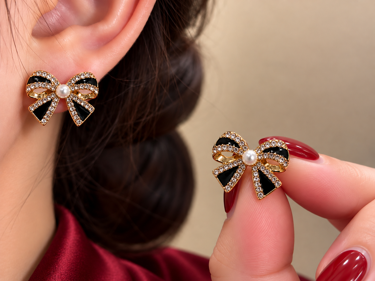Gold-Tone Black Crystal Bow Stud Earrings with Pearl Centers