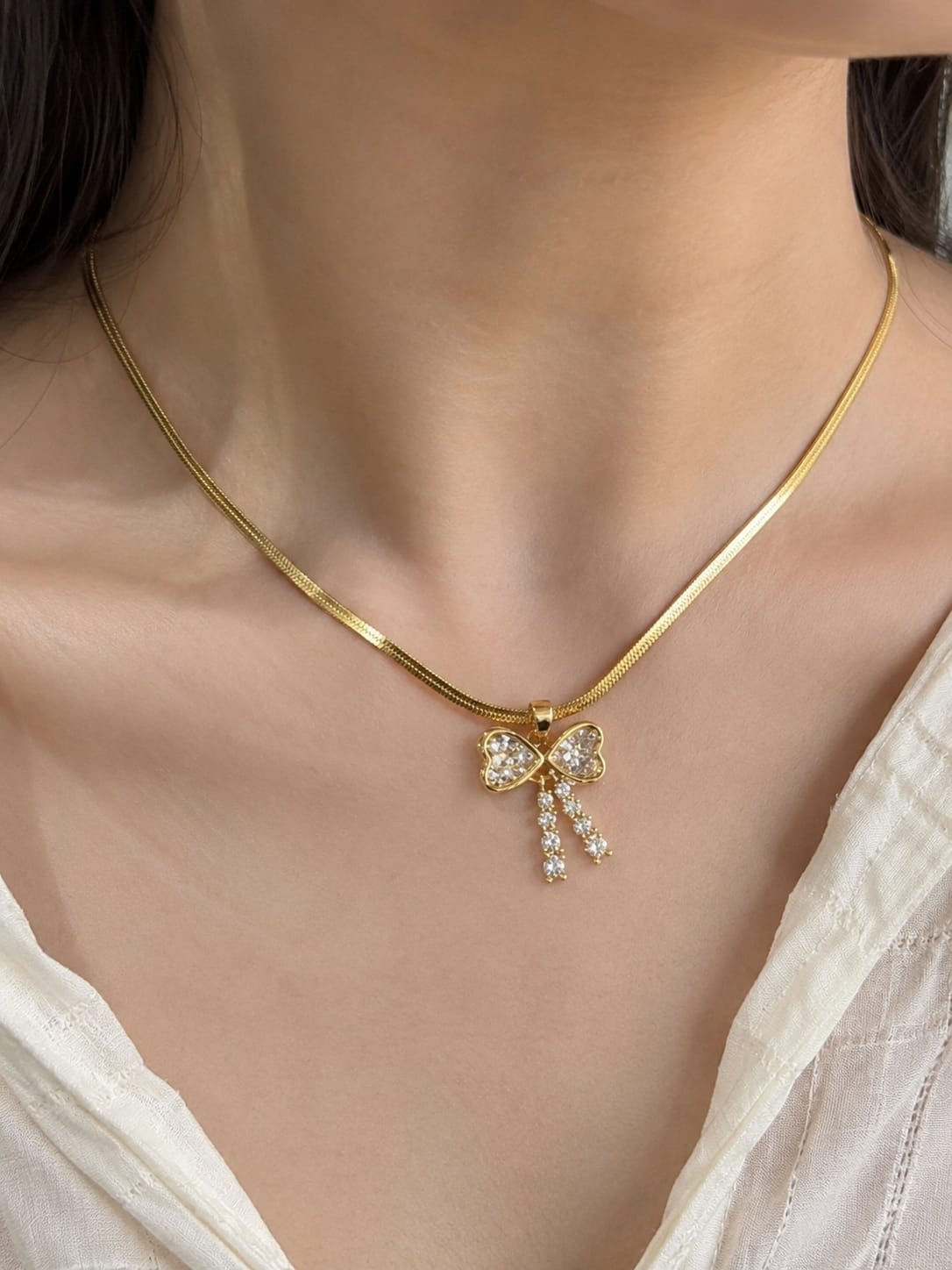 Crystal Bow Charm Snake Chain Necklace