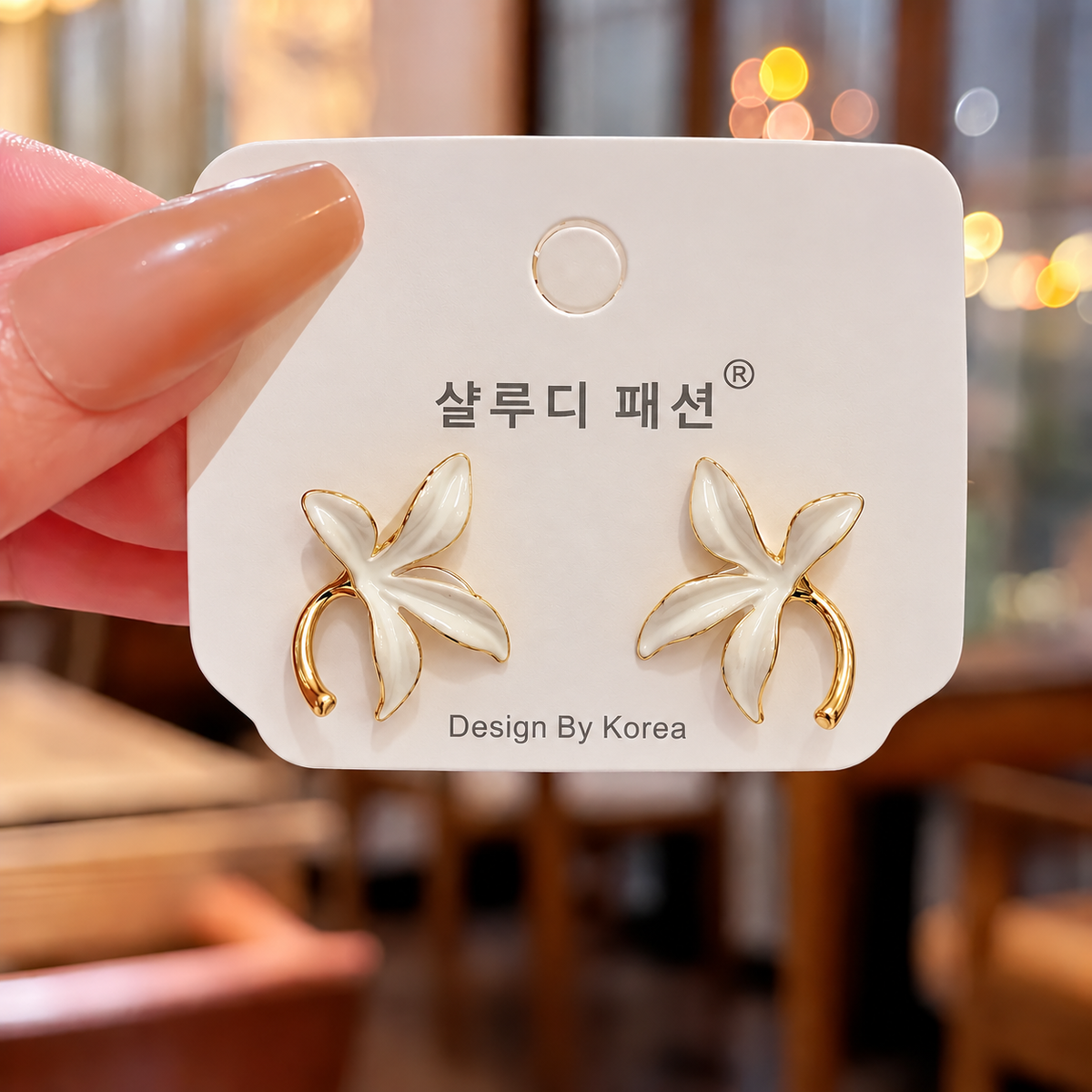 white enameled floral and leaf-stem stud earring