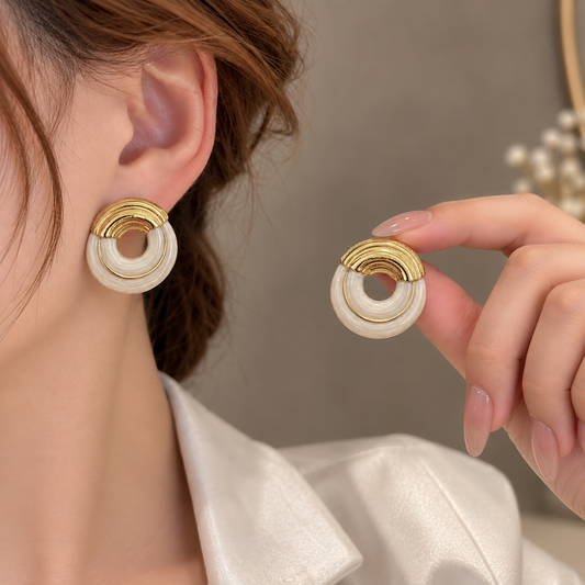 half-halo statement earrings with a textured circular design.