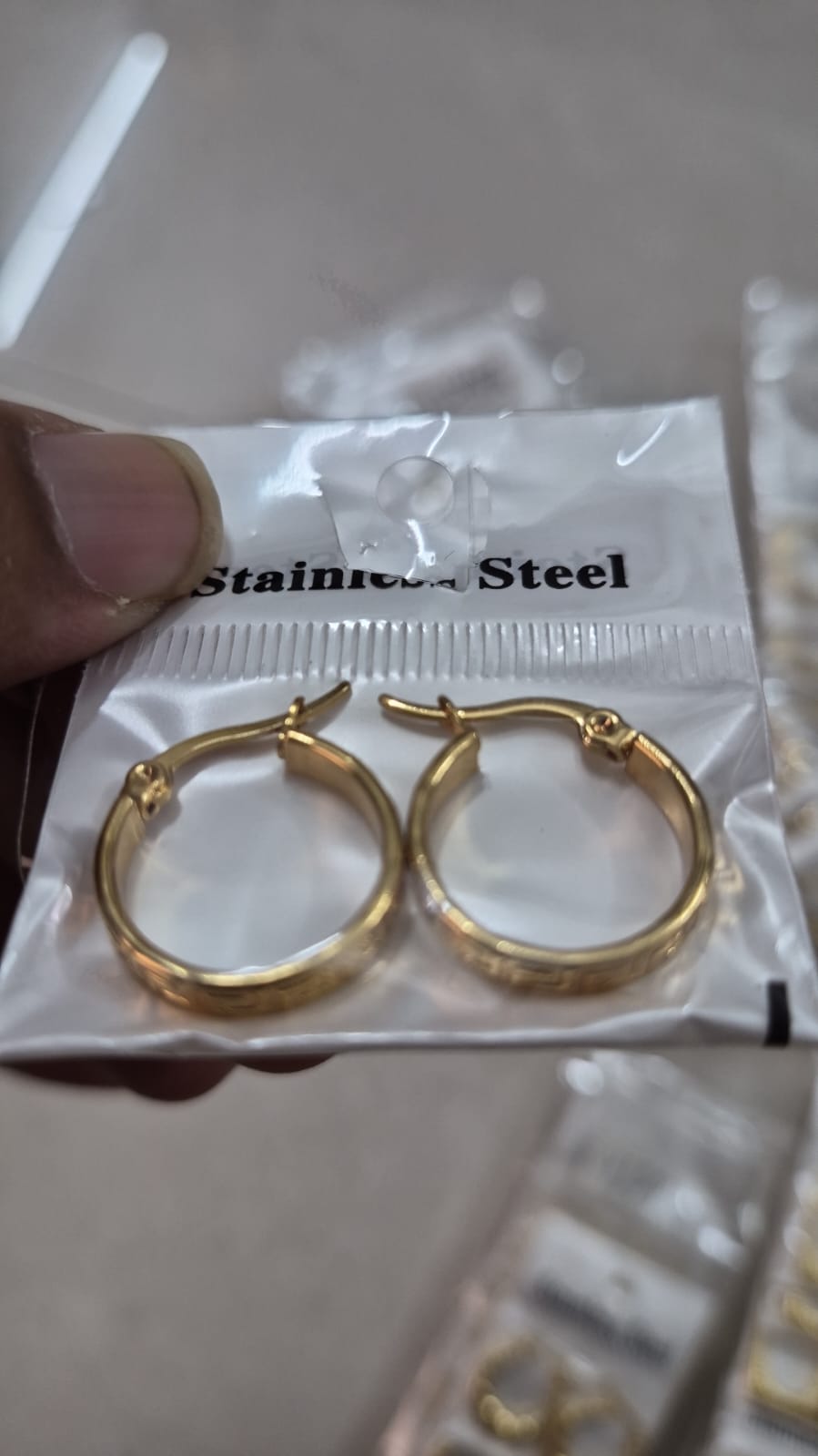 Anti tarnished hoop earring with a latch-back closure