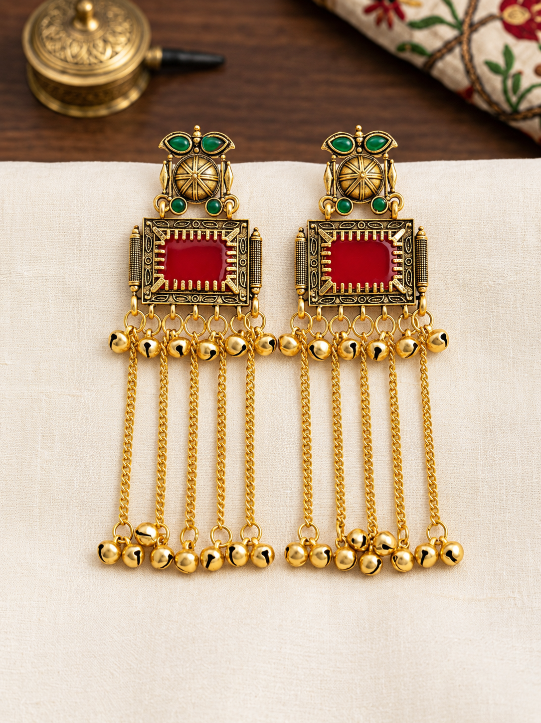 Kashmiri-style dangling earring with red stone hanging chain