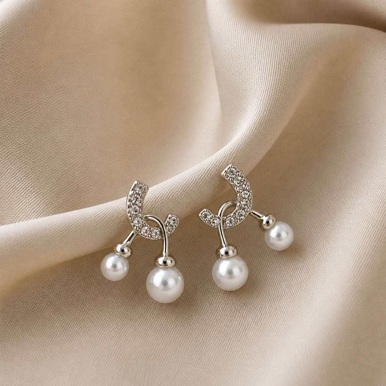 Elegant Pearl Drop Curve Earrings with Crystal Detailing
