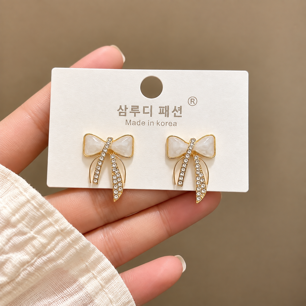 white enamel-style bow-shaped Korean stud earring