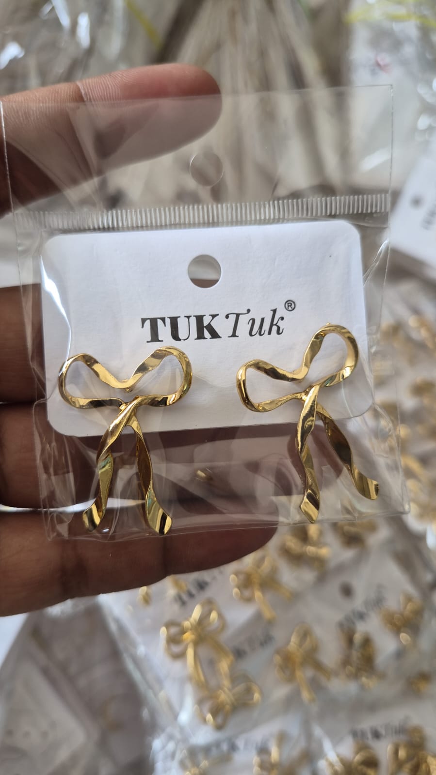 Anti tarnished gold-toned metal ribbon bow earrings