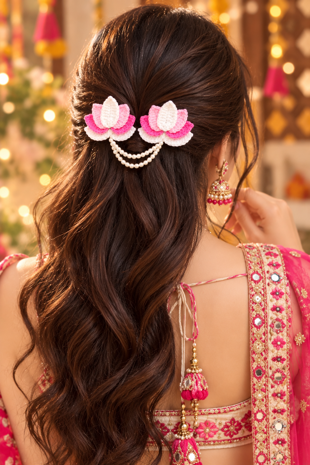 handmade crochet lotus flower hair clip featuring pink and white yarn petals connected by a double pearl bead chain