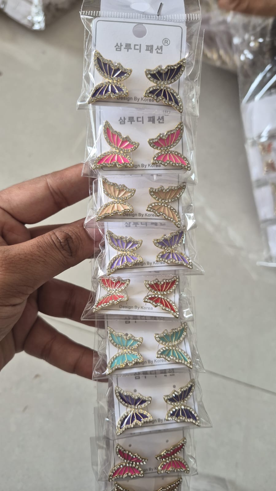 rhinestone-embellished butterfly enamel earrings