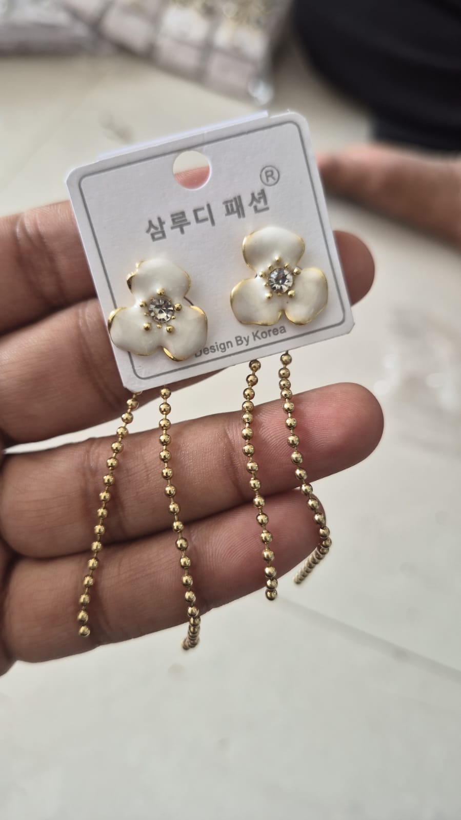 three-petaled white enamel flower stud earrings