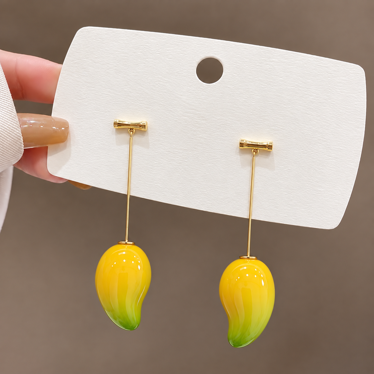 drop earring with yellow and green mango-shaped charms.