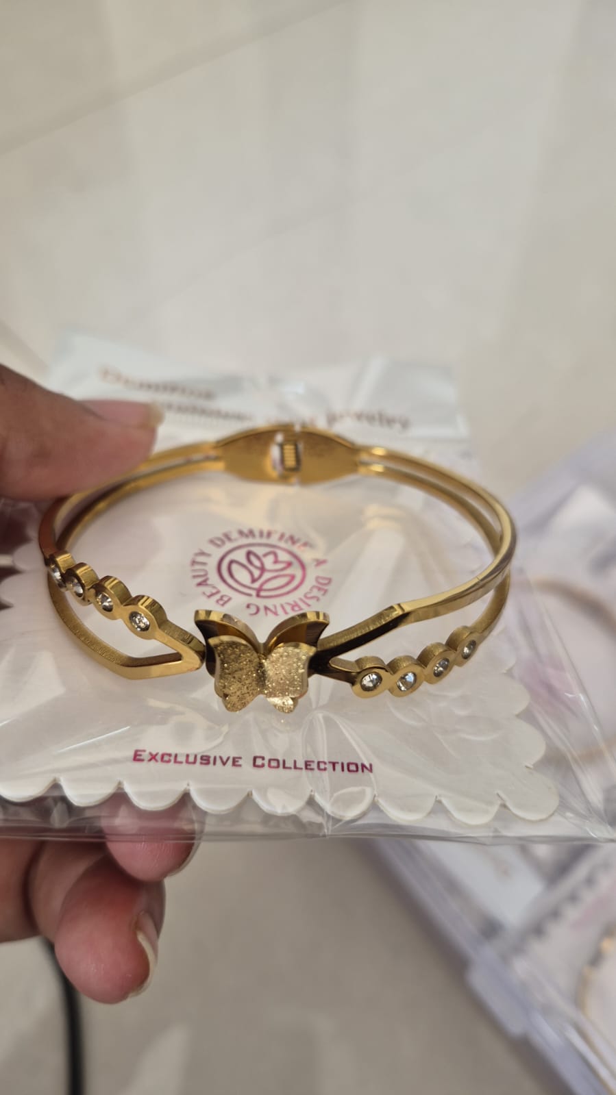 Butterfly charm and sparkling crystal-studded anti tarnished bracelet regular size