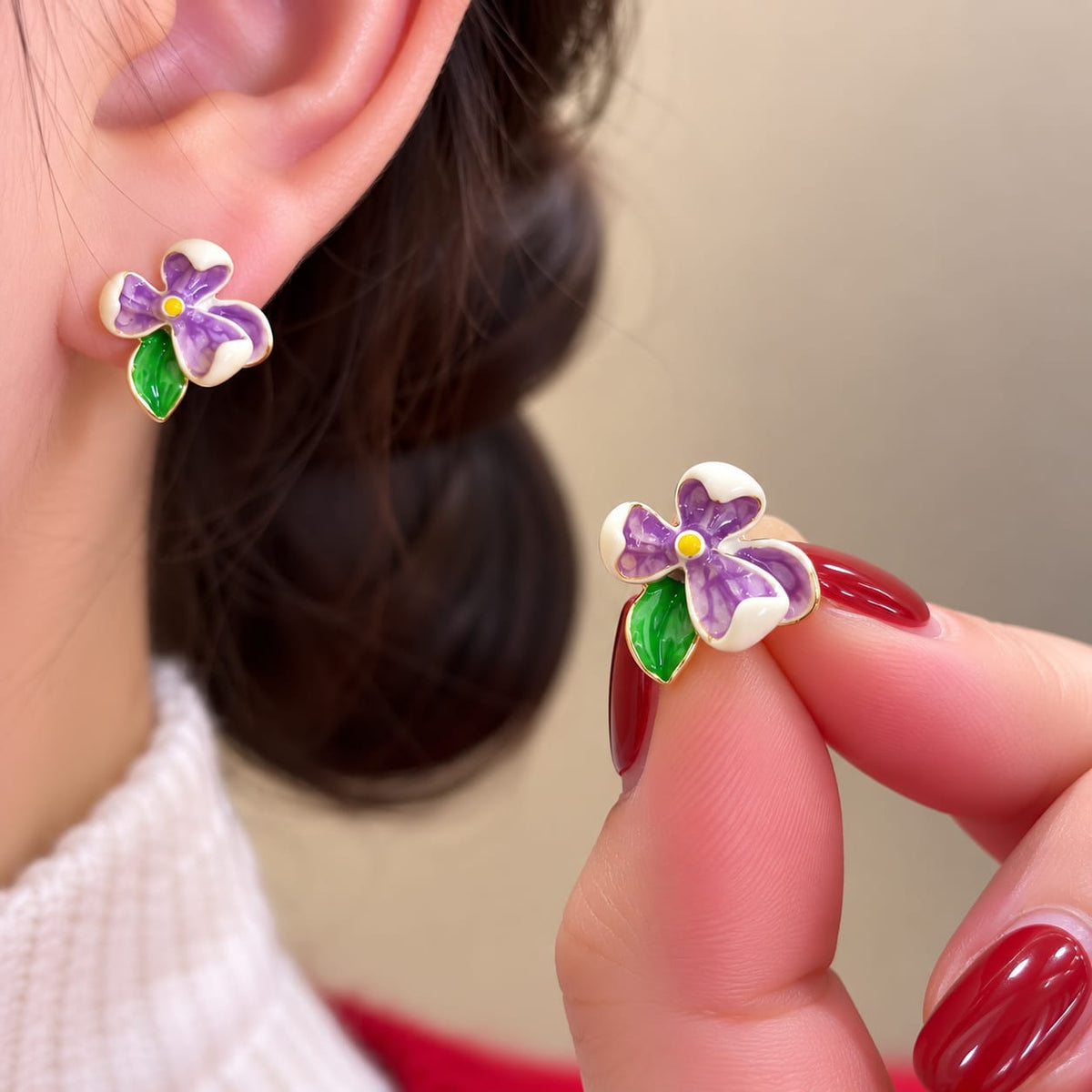 Flower Stud Earrings, featuring colorful enamel floral designs with green leaf accents.