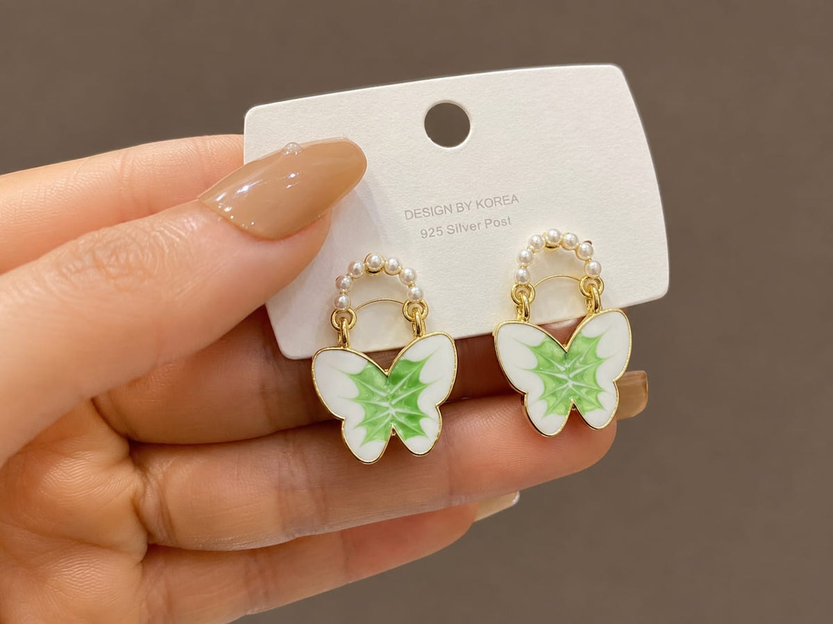 enamel butterfly design accented with small faux pearls