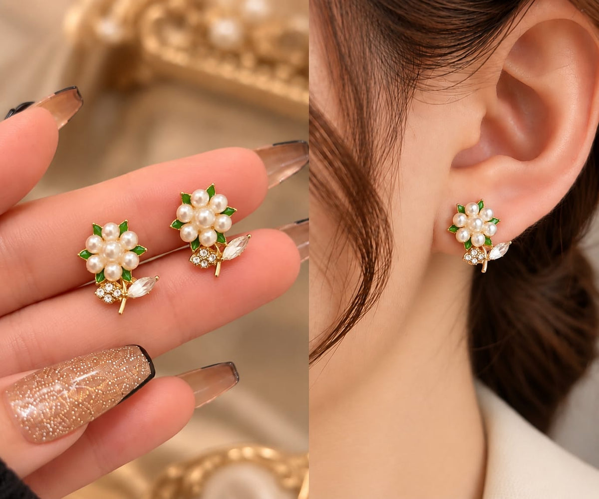 Gold-plated floral stud earrings featuring white faux pearls