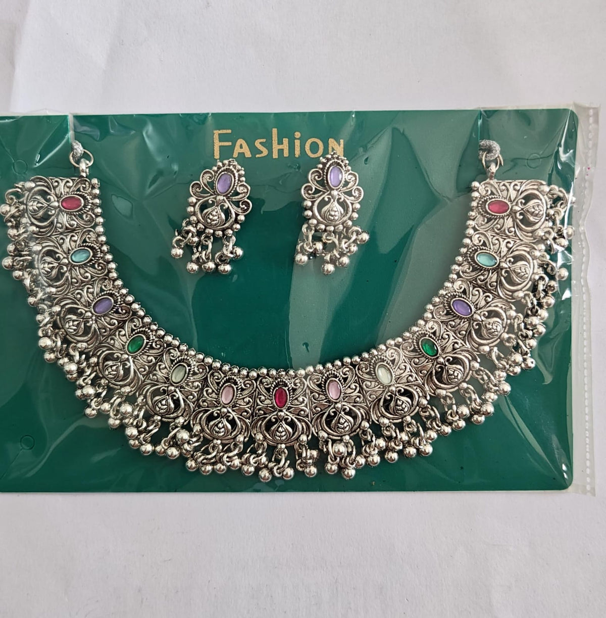 oxidised choker necklace and earrings set 
Earring stone  random colour