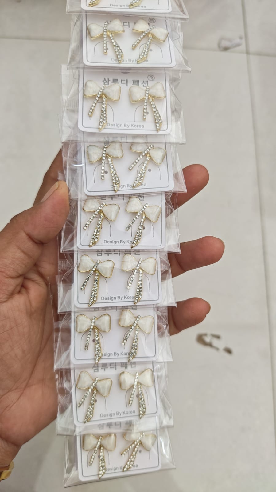 white enamel-style bow-shaped Korean stud earring
