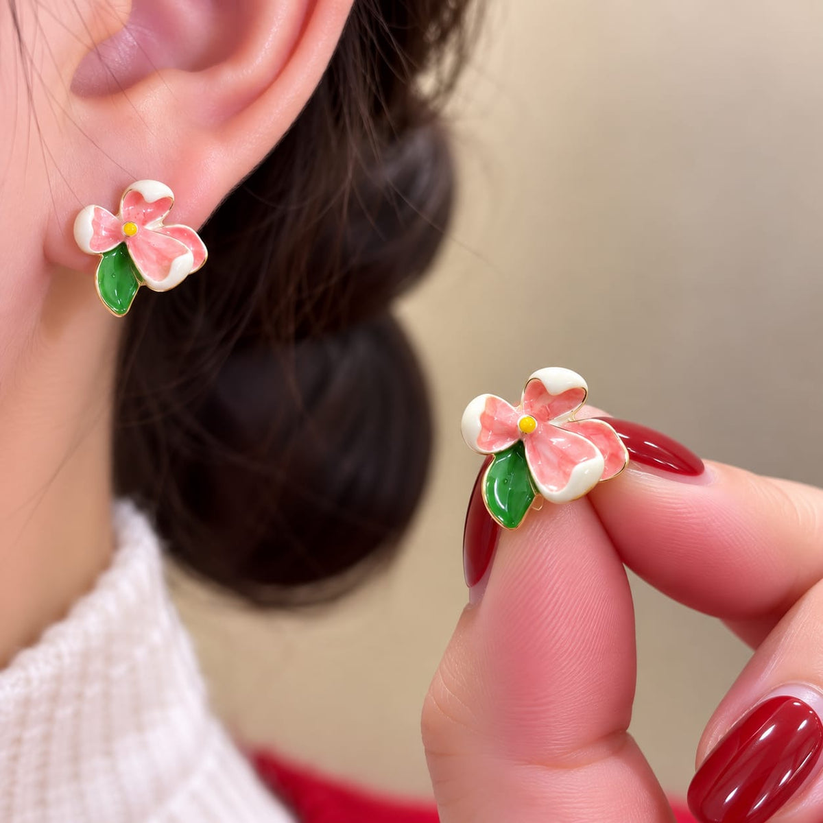 Flower Stud Earrings, featuring colorful enamel floral designs with green leaf accents.
