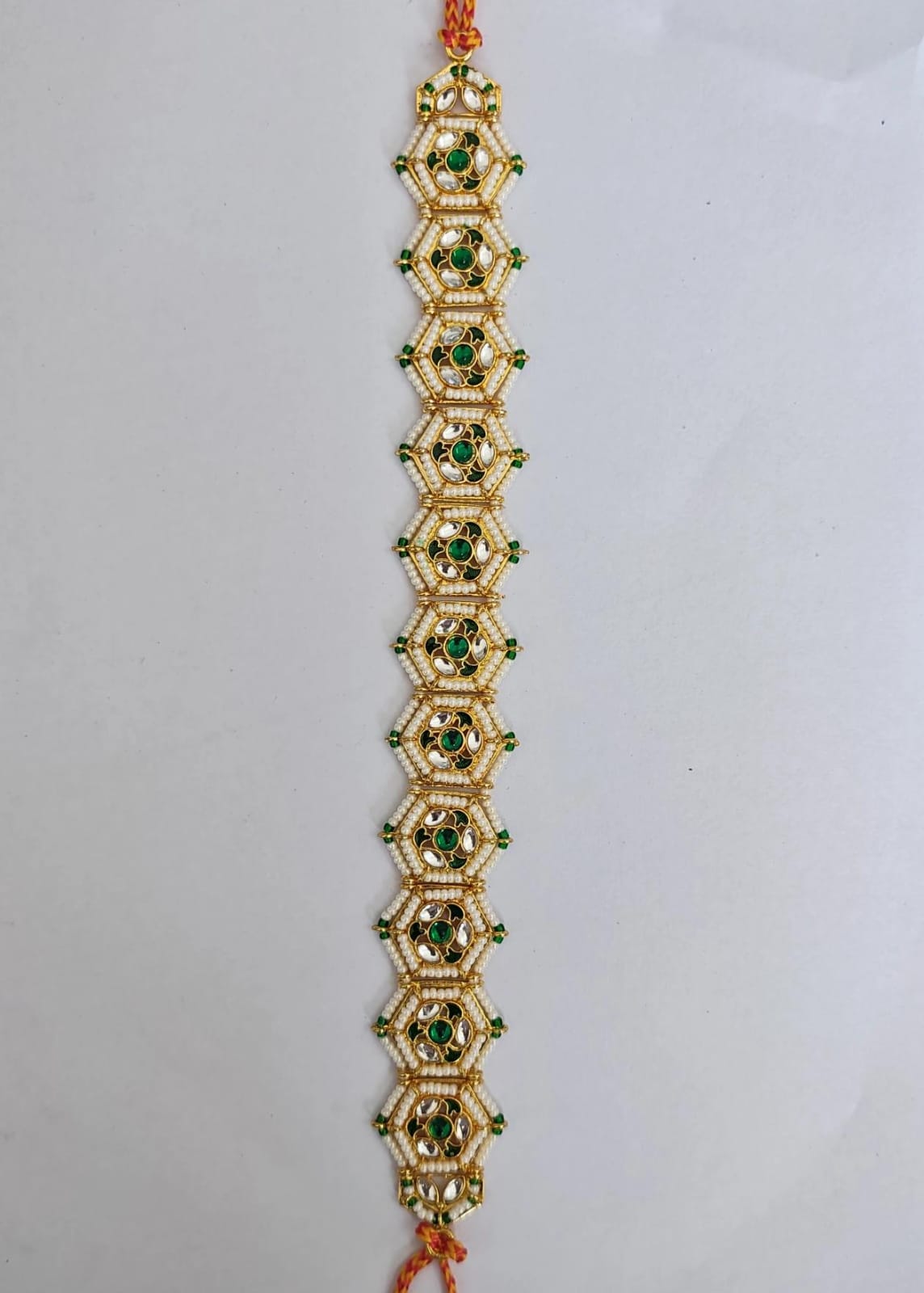 gold-plated green Kundan and pearl hair accessory