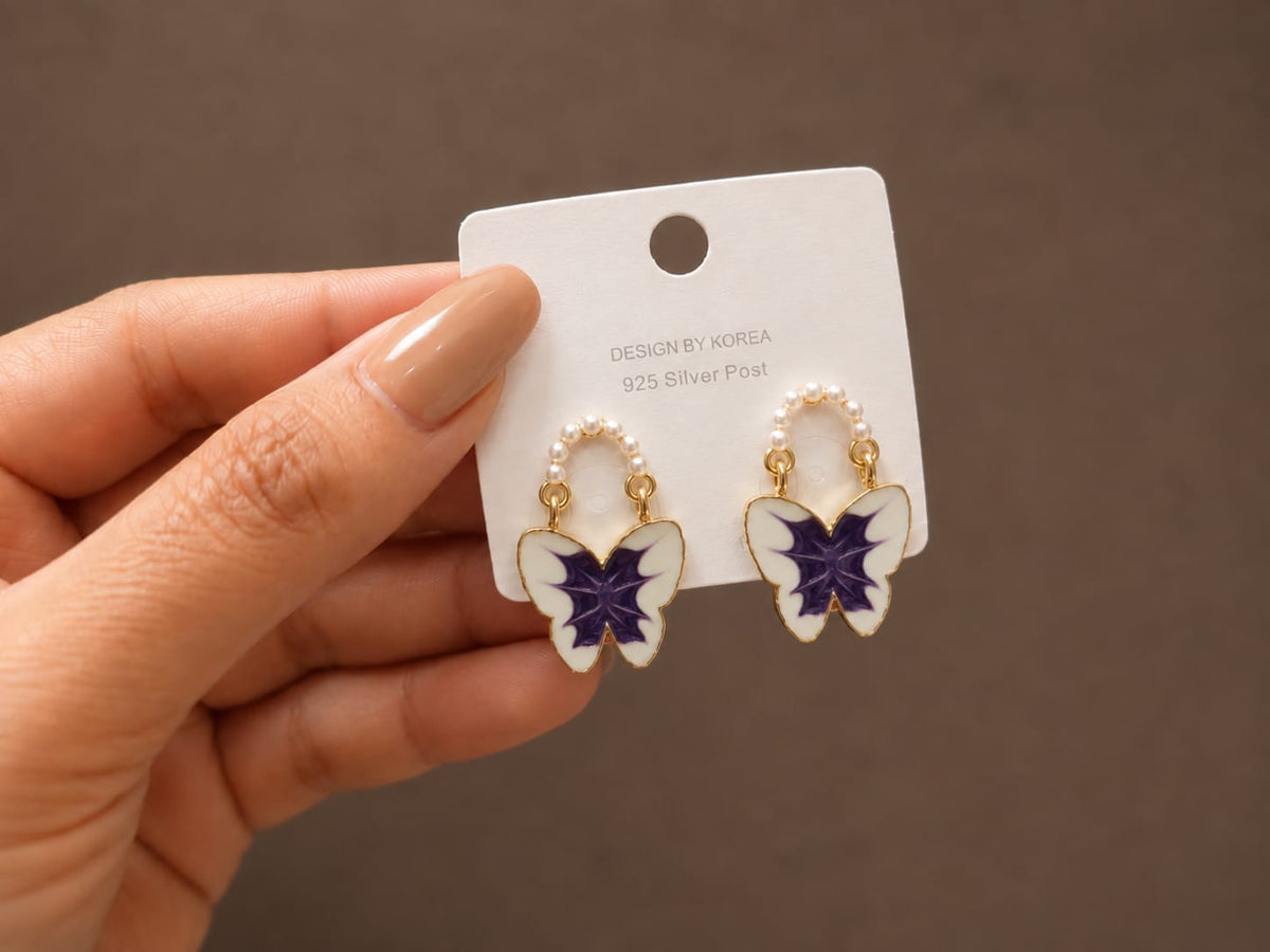 enamel butterfly design accented with small faux pearls