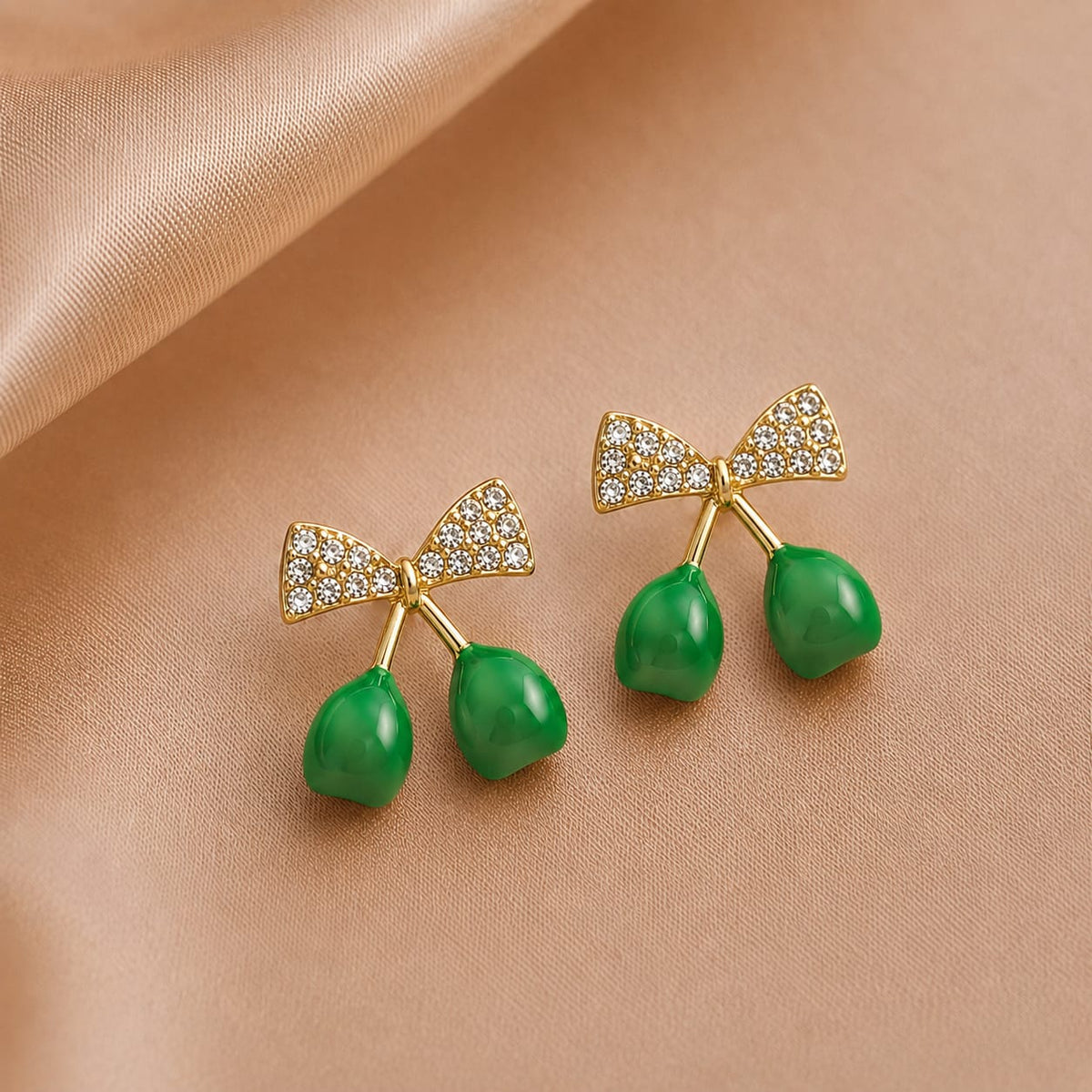 crystal bows paired with glossy cherry drop charms.