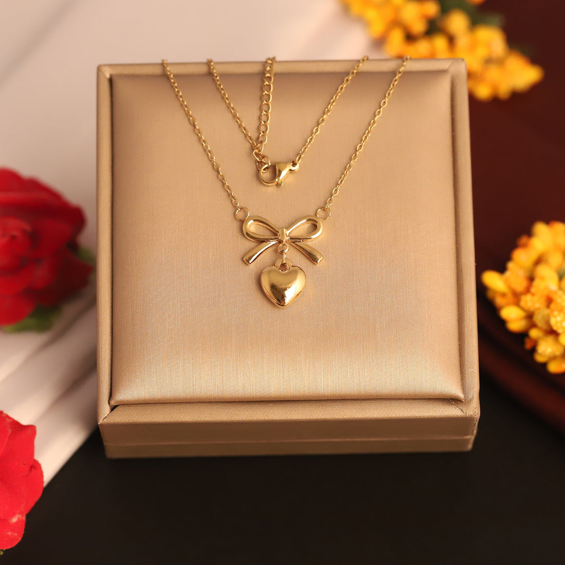 Anti tarnished heart with bow design necklace