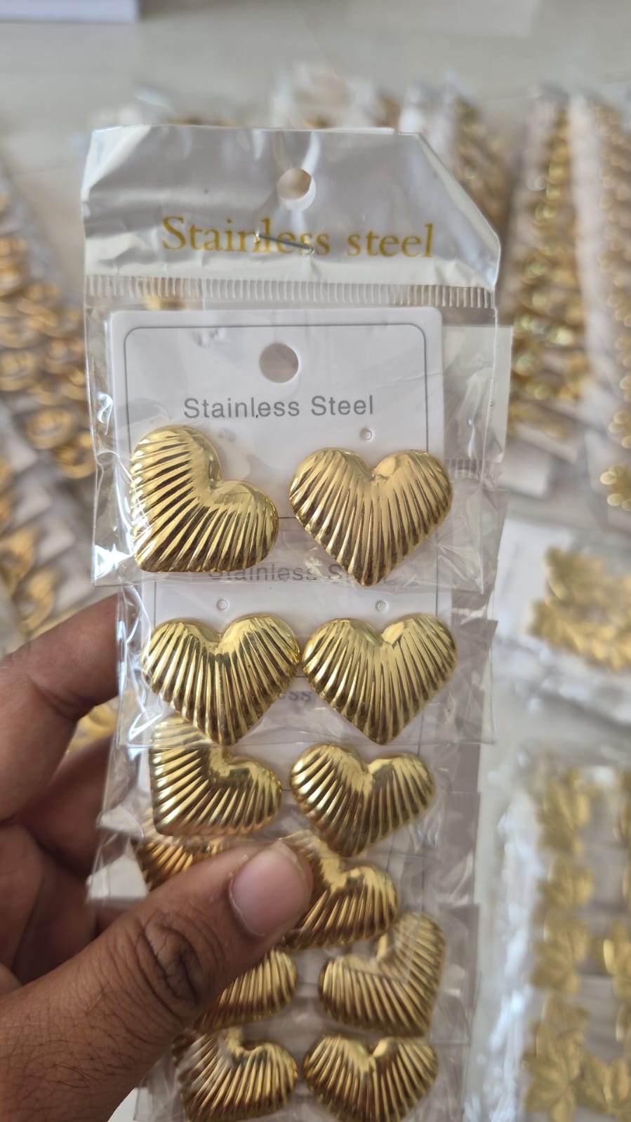 gold-toned, ribbed heart-shaped stud earring Stainless Steel