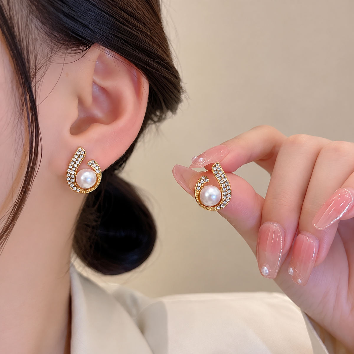 white faux-pearl, and crystal horseshoe-style stud earring