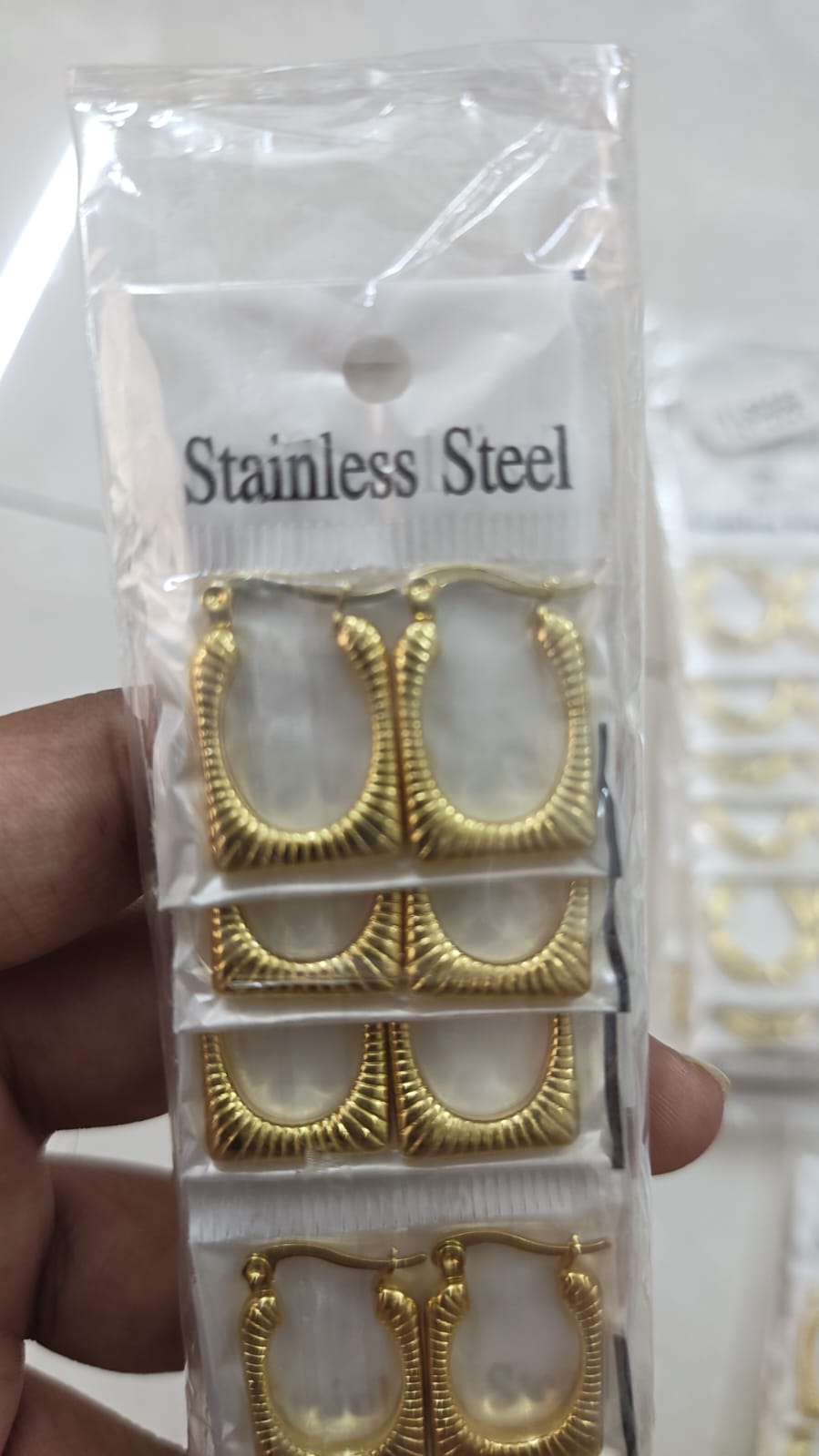 Demi fine rectangular hoop earring with a ribbed design