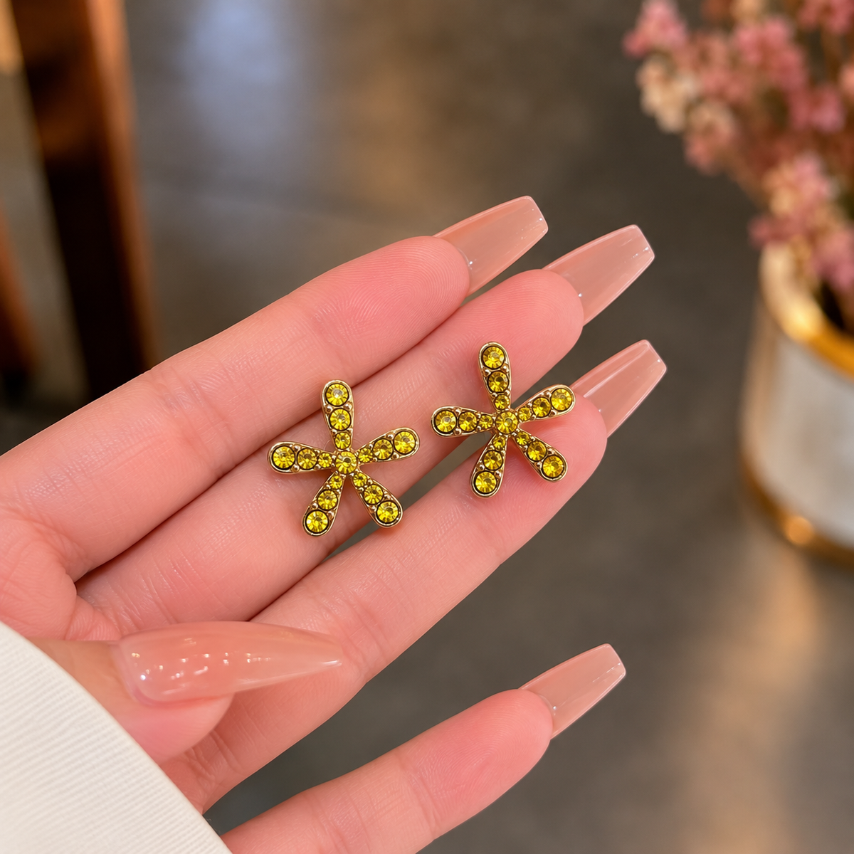 flower stud earring adorned with sparkling crystal stone