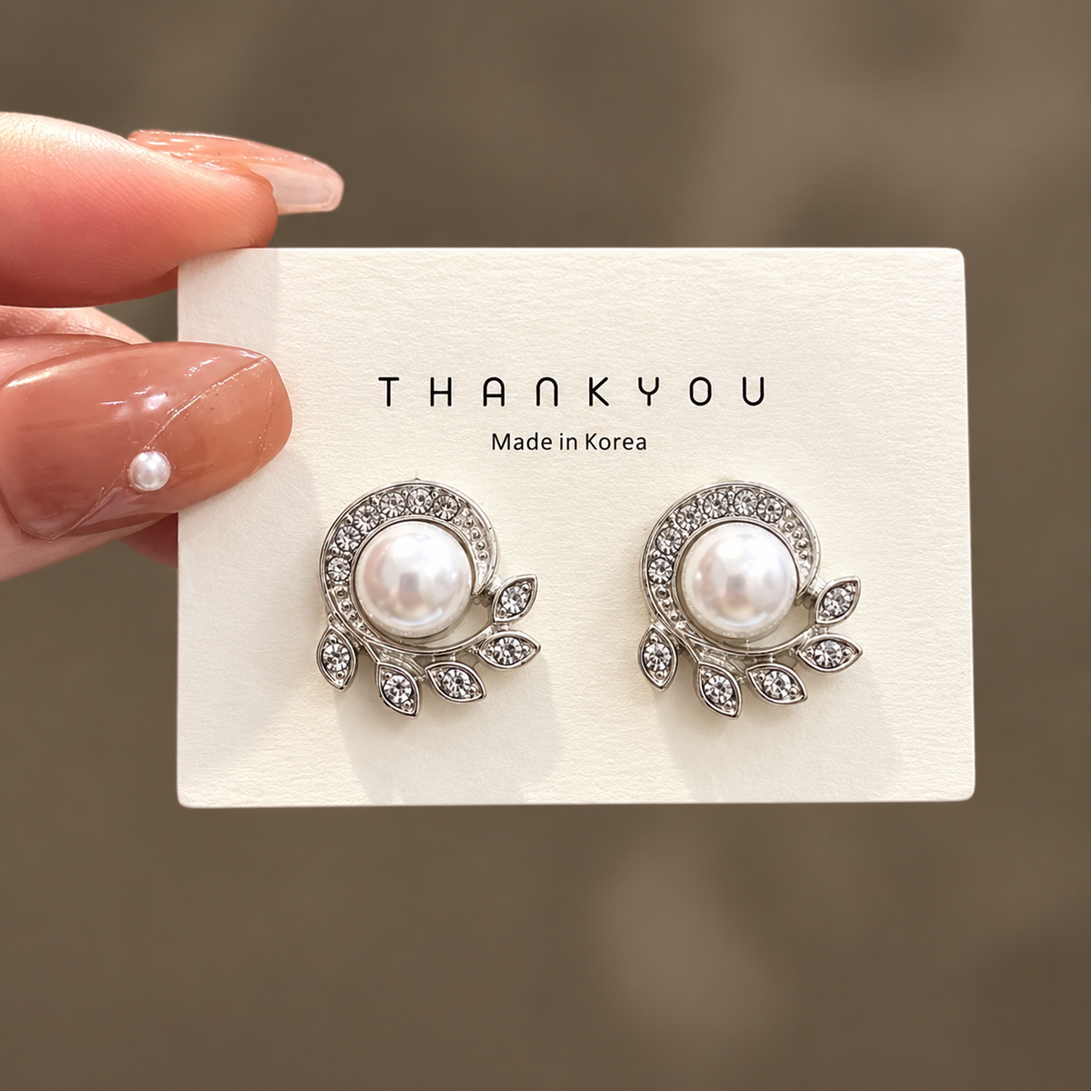 silver-plated leaf design with pearl stud earring