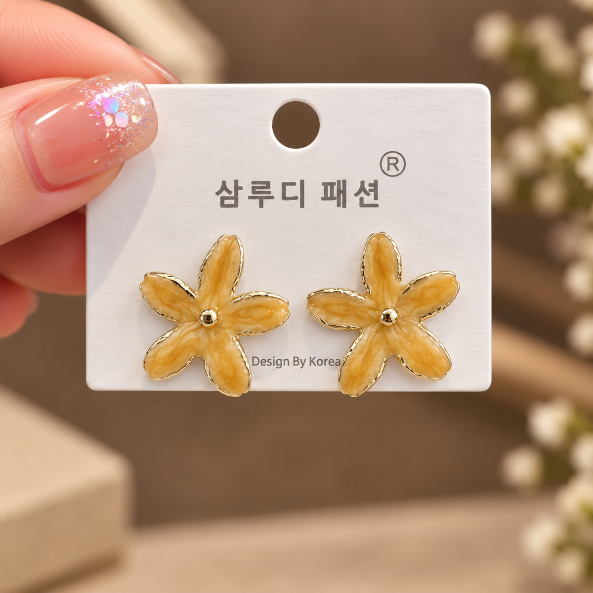 enamel flower stud earrings featuring gold-toned