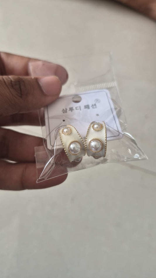 white enamel C-hoop earrings with  clustered faux pearls.