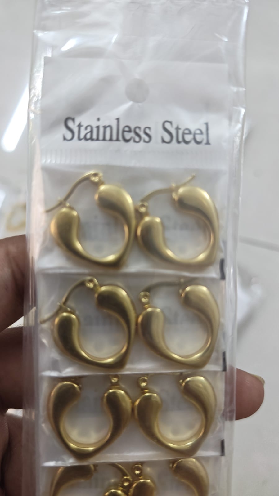 stainless steel abstract or open heart-shaped hoop earring