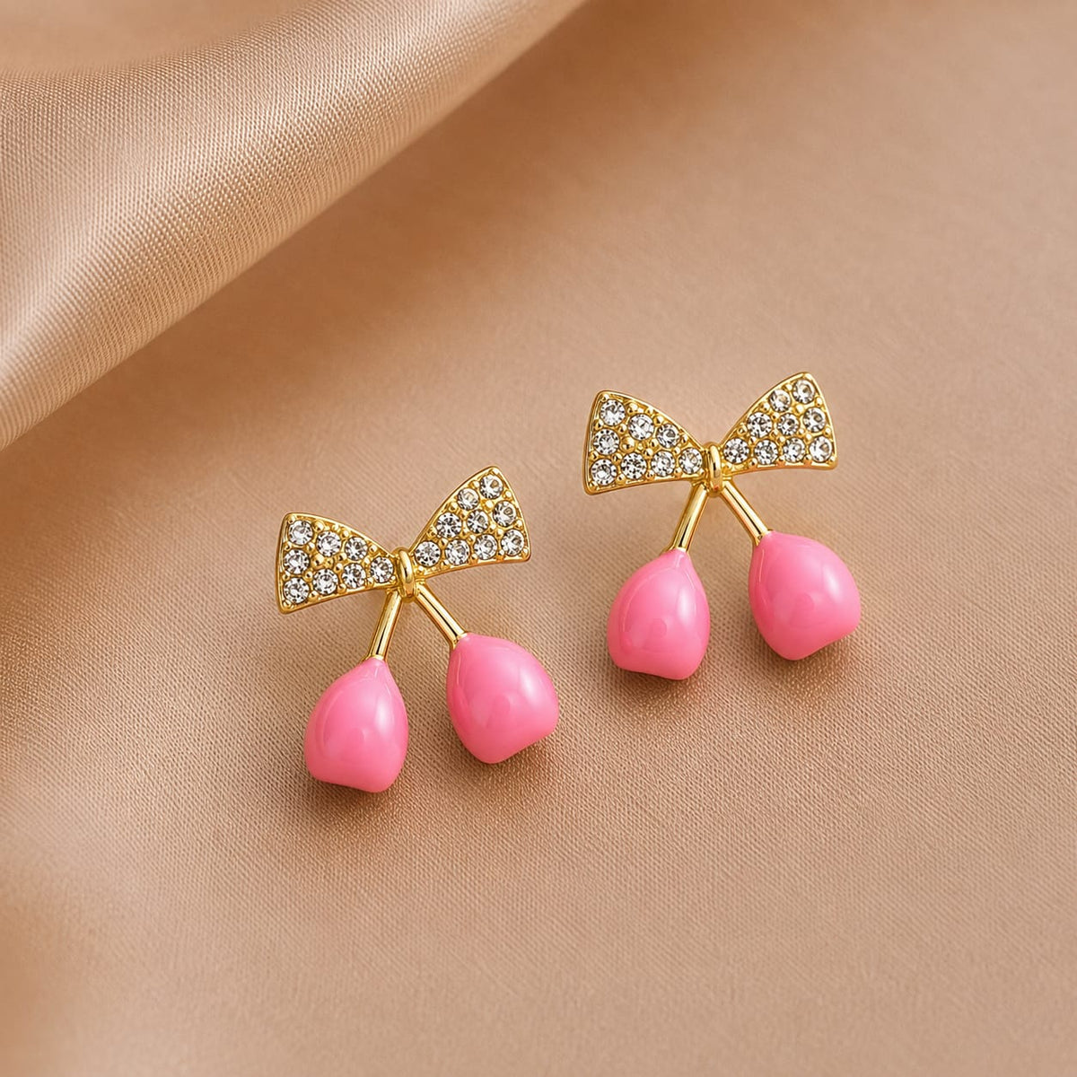 crystal bows paired with glossy cherry drop charms.