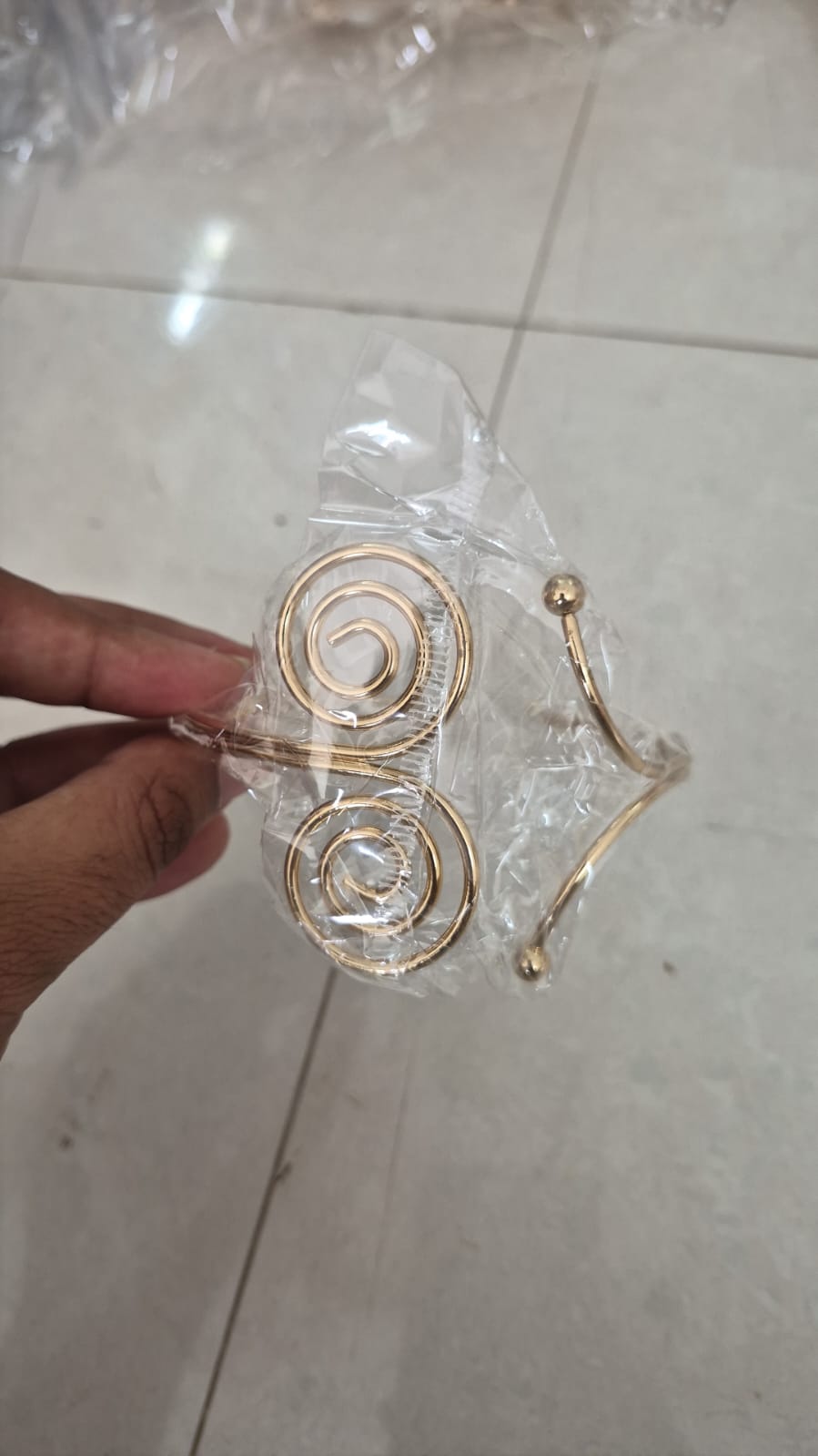 Gold-toned open-coil upper arm cuff adjustable