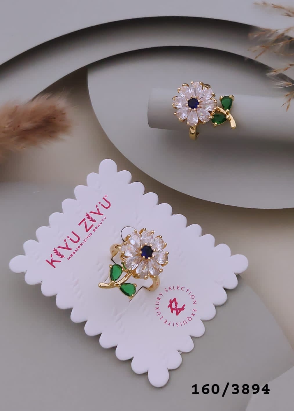 Gold-Tone Floral Ring with White Stones and Green Leaf Accents (rotate)