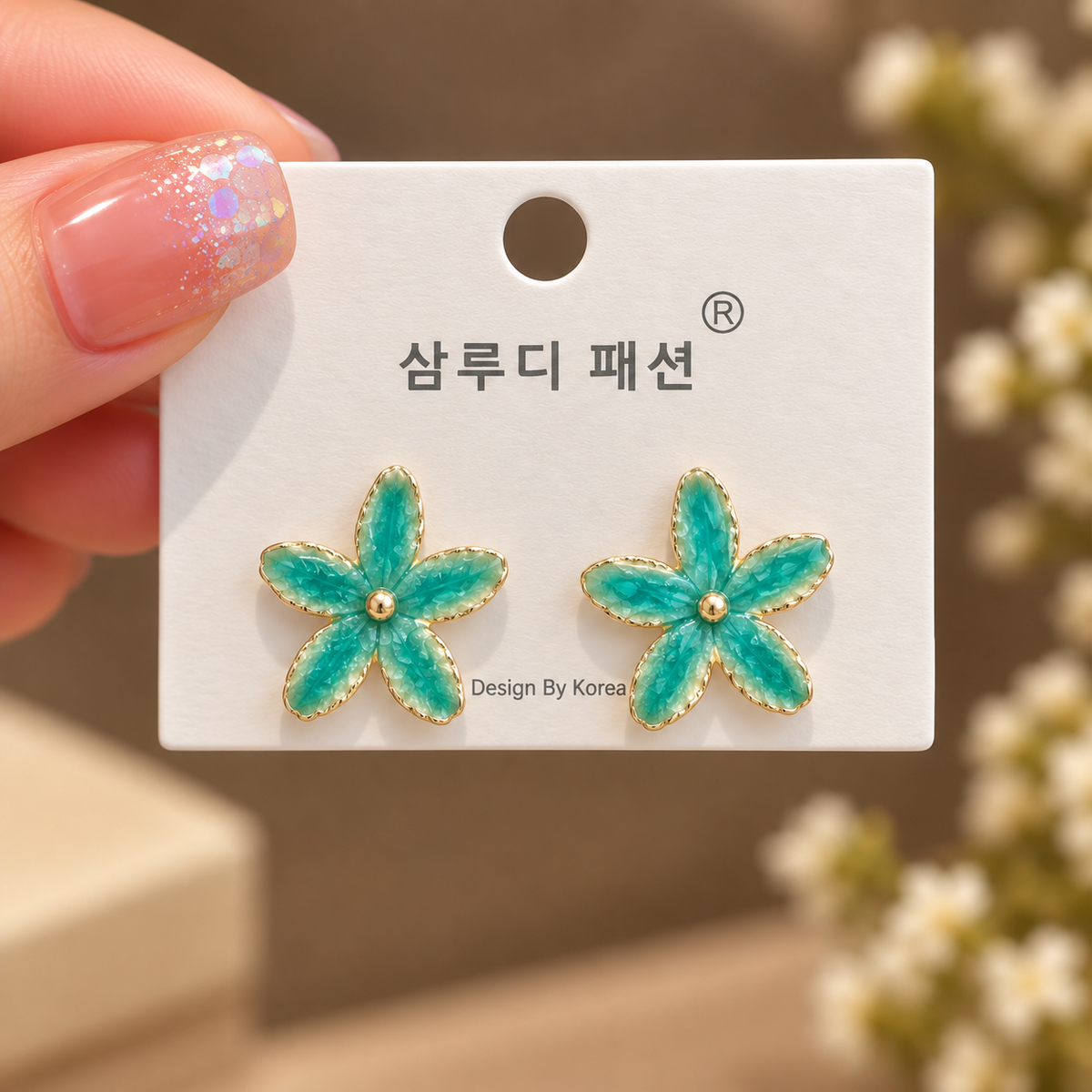 enamel flower stud earrings featuring gold-toned