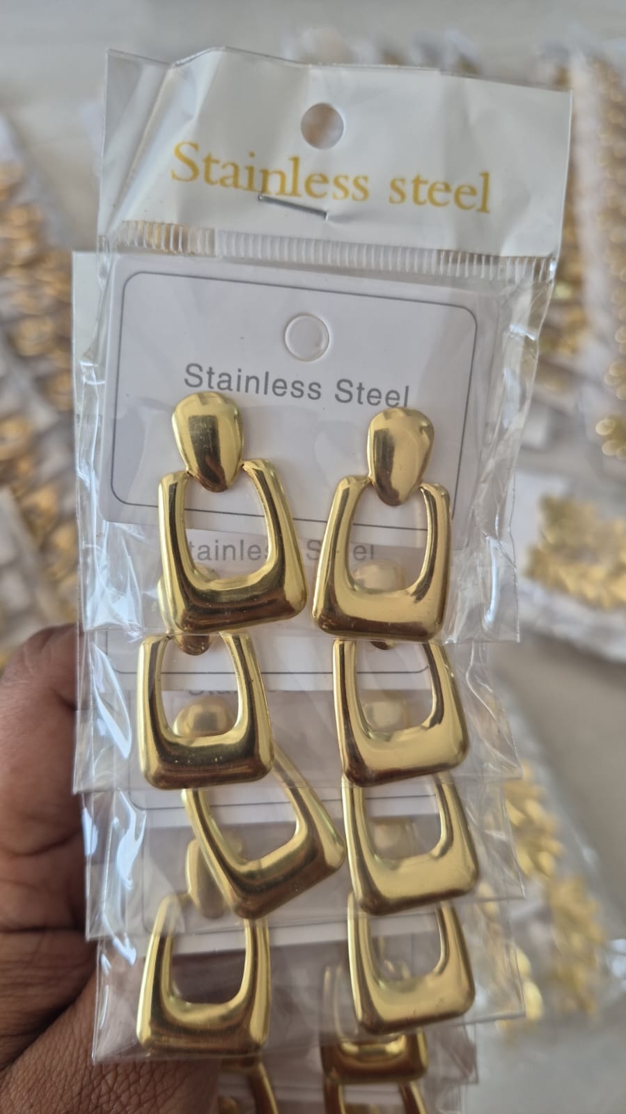gold-toned stainless steel geometric drop earrings