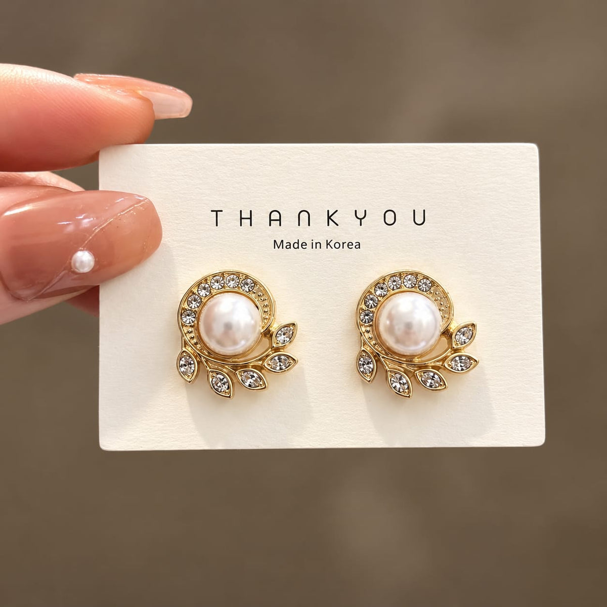leaf design with pearl stud earring