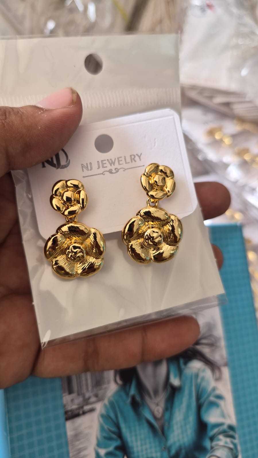 Anti tarnished camellia flower dangle earrings featuring
